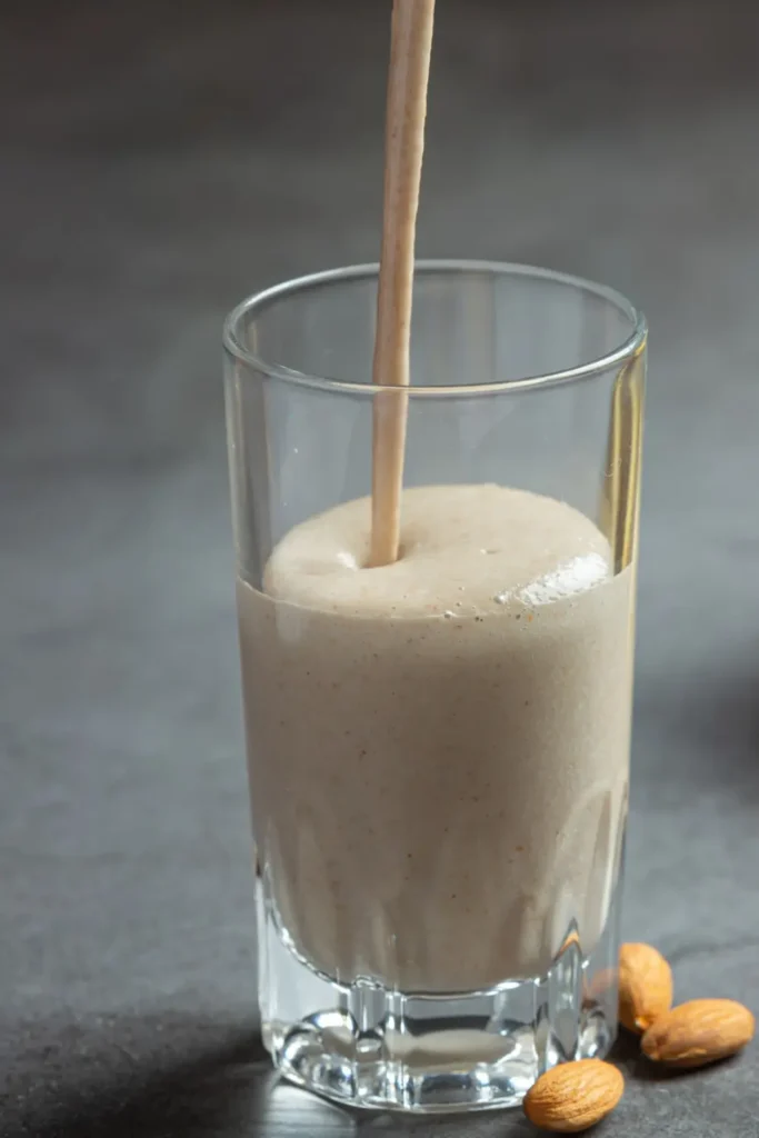 one glass Peanut Butter Protein Shake with straw